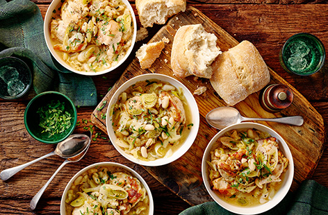 Serve up this autumnal dish for the perfect midweek meal. Tender chicken thighs are simmered with white wine, cannellini beans and tarragon and served with warm crusty bread in this comforting recipe. Use the leftover stew the next day to make a creamy Chicken and ricotta galette, see tip, below.