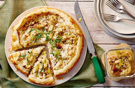 Use leftover chicken stew to make this simple yet special galette. Top ready-made puff pastry with creamy ricotta and the leftover stew before baking in the oven. Finish with plenty of fresh tarragon. Delicious!