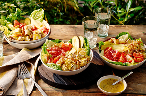 Inspired by the Cuban sandwich, these salad bowls are made with leftover roast pork, crispy bread croutons, cheese, salami and sweet pickle slices.