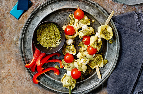 Kids will love trying tortelloni in this new way – made into skewers with mozzarella and tomatoes – served with a pesto dip.