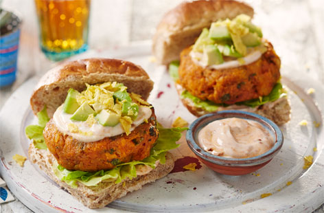 Add a Mexican touch to your veggie burgers, by combining sweet potato with rice, coriander, almonds and spices. The burgers are gluten-free, so can be served with gluten-free rolls and gluten-free tortilla chips. If gluten isn't an issue, use 2tsp breadcrumbs instead of the ground almonds.