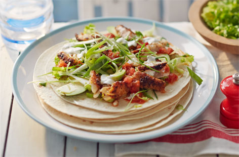 Give your midweek meals a summery spin with this fantastic recipe. Succulent white fish fillets are marinated in cajun spice before being fried and piled into soft tortillas with avocado, salsa and a creamy dressing