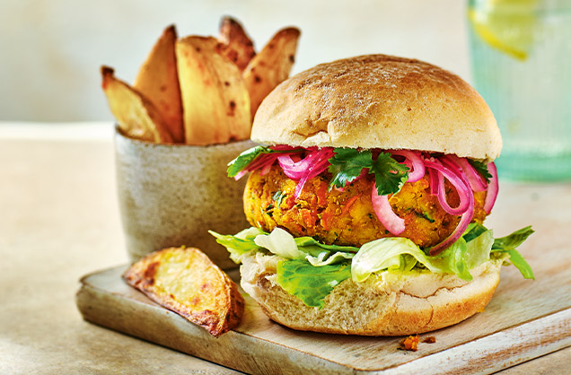 Spiced red lentil burgers with potato wedges