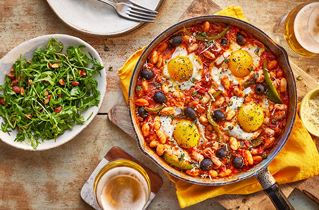 Baked eggs and Manchego with an almond salad
