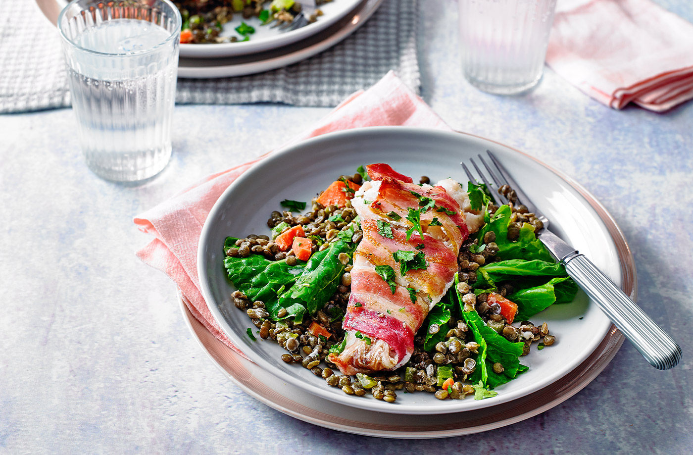 Bacon-wrapped fish with creamy lentils recipe