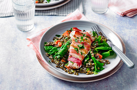 A speedy and simple family dinner, this bacon-wrapped fish with creamy lentils recipe shows what you can do with just a few key ingredients