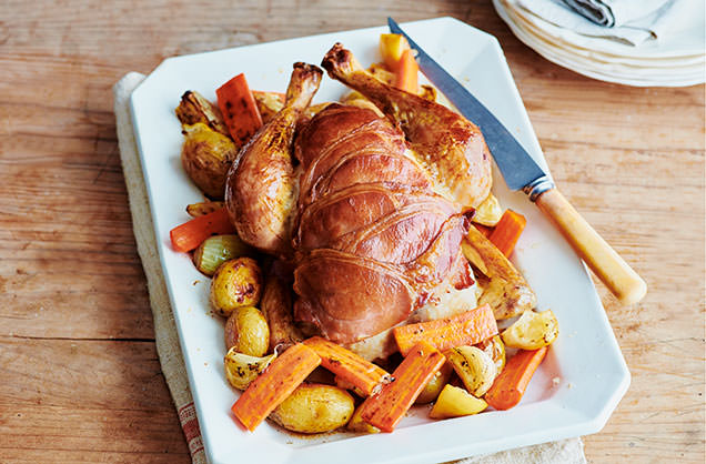 Bacon-wrapped roast chicken with lemons and potatoes recipe