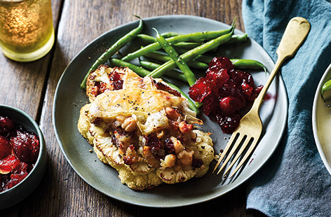 Give veggie-favourite cauliflower steaks a festive makeover with creamy Cornish Brie and sweet cranberry sauce for a mouth-watering vegetarian Christmas dinner