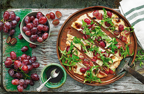Sweet, juicy grapes are a perfect match for creamy brie and peppery rocket on these rustic flatbreads. A sophisticated snack to share with friends.