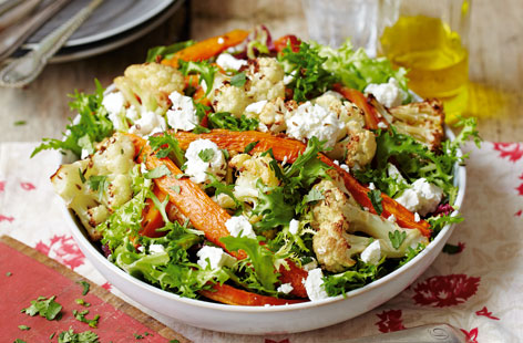 Sweet roasted carrots and salty crumbles of feta cheese go together wonderfully in this crisp and crunchy salad. More than just a side, it's a lightly spiced salad that makes an excellent meal in and of itself.