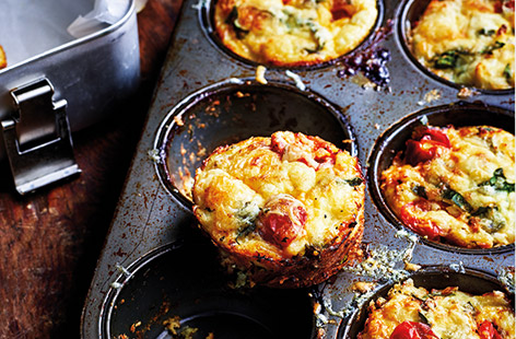 Liven up lunchboxes with these cauliflower cheese bites using creamy Cheddar cheese, spinach and cherry tomatoes