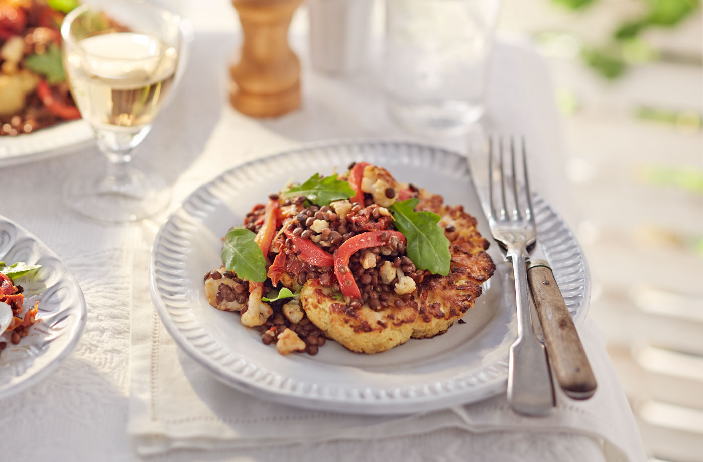 Roast cauliflower steaks with puy lentil, goat’s cheese and pepper salad recipe