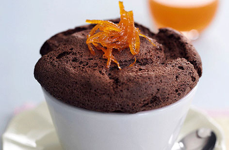 These chocolate soufflés are an absolute showstopper. The perfect ending to a special dinner for four lucky people. A cardamom and orange sauce is prepared and poured over the top of the soufflés just before serving.