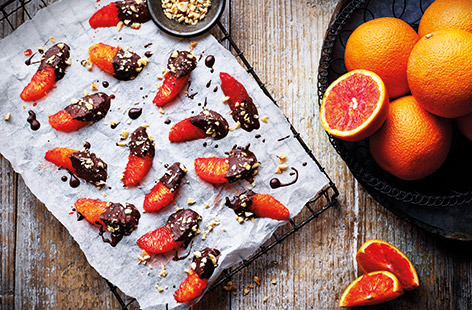 For an easy sweet snack that's ready in no time, try these chocolate-dipped orange segments with juicy Jaffa red oranges