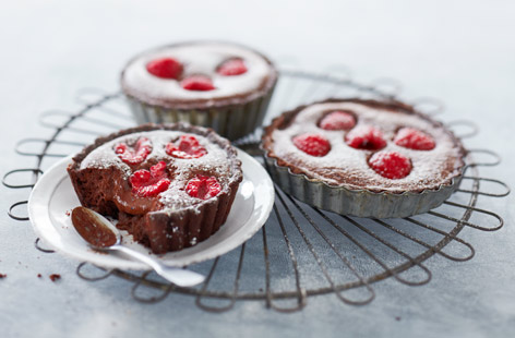 Make these delicious chocolate tarts with fresh raspberries, served with a dollop of cream