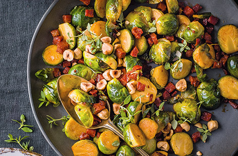 It wouldn't be Christmas without Brussels sprouts. Try something new this year with tangy chorizo, buttery hazelnuts and herby thyme for a winning side dish that everyone will love.