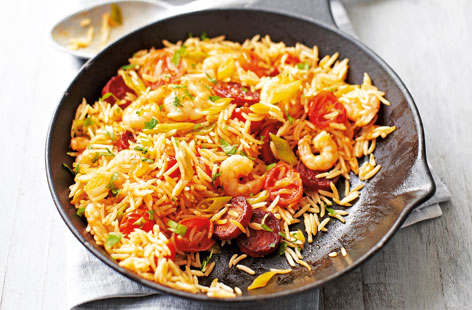 Whip up this delicious dinner for two, which combines more-ish chorizo and juicy prawns with rich tomatoes, spring onions and fluffy rice