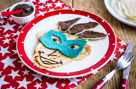 Just a few simple and delicious decorations and this pancake has become an evil comic book villain