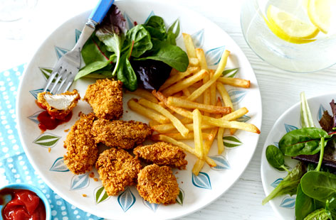 A lighter twist on a classic kids' favourite, these baked chicken nuggets are made with cornflakes for extra crunch