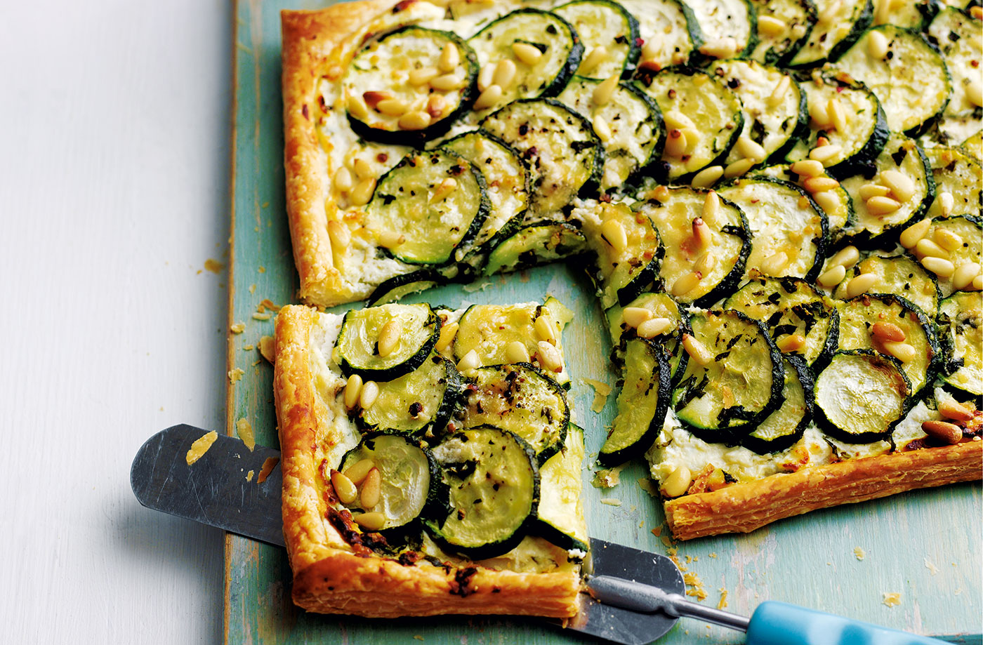Courgette, basil and ricotta tart with pine nuts recipe