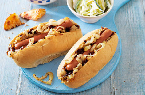 An American classic with a honey-mustard twist - these tasty hot dogs are paired with paprika-spiced wedges that are fluffy on the inside and crunchy on the outside and a crisp, creamy apple slaw