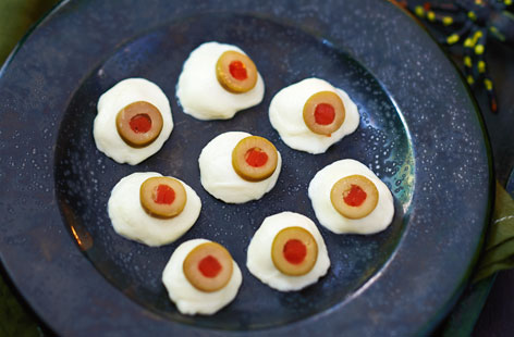 These creepy little bites, made with mozzarella pearls and stuffed olives, make a great savoury party snack