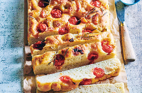 This beautiful Italian focaccia is packed with roasted garlic, cherry tomatoes and fragrant rosemary, and makes a deliciously aromatic loaf that's perfect for sharing with friends