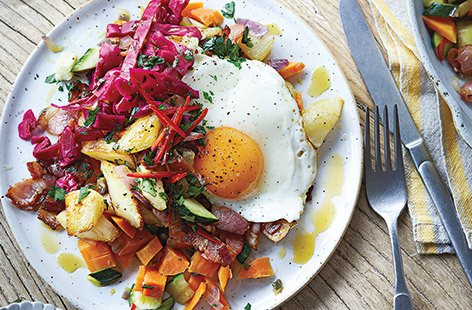 For an easy way to tempt all the family to eat more veg, try this potato hash recipe with onions, carrots, courgettes, parsley and topped with an egg