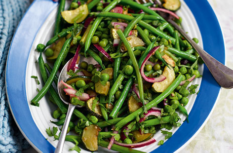 A tasty, healthy side of greens that makes the most of summery veg. Pour the tangy red wine vinaigrette over the crunchy green bean, tender courgette and sweet pea medley. Or crumble over some feta and a sprinkling of chilli flakes and enjoy it for lunch.