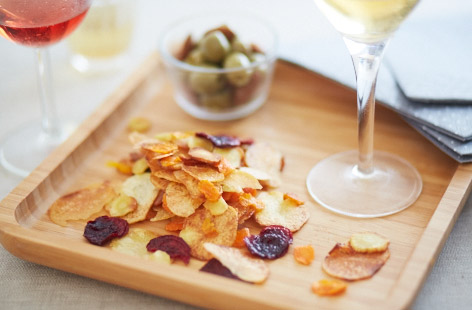 Starring carrot, parsnip and potato, these delicious baked vegetable crisps are the ultimate healthy swap for your usual packet of crisps - and they only take 20 minutes to make, perfect for when the urge to snack arises