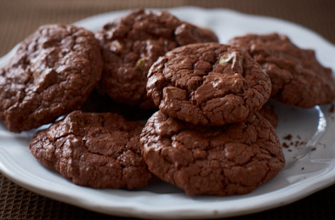 These rich and decadent chocolate cookies are given a delicious nuttiness through chopped pistachios and a warming spice through cardamom