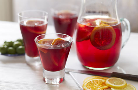This traditional sangria recipe makes for the perfect fruity summer drink and is simple to prepare. Just remember to make the apple juice ice cubes in advance of mixing the punch and to chill it well before serving. Salud!