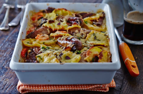 An indulgent slow-cooked hotpot with sausage and bacon. Try this traditional Irish recipe, packed full of hearty root vegetables, flavoured with thyme and all finished off with melted Cheddar cheese.