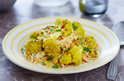 This healthy one-pot rice dish is great for using up your store cupboard stocks and is vegan friendly. Spicy and warming, with chunky cauliflower and filling lentils, this is a winter dish that's full of flavour.