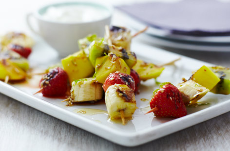 Serve a fruit salad with a twist. Tropical mango, zingy kiwi fruit, juicy strawberries and sweet bananas are combined with lime, honey and sesame seeds. Grill or barbecue and enjoy with some natural yogurt.