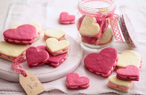 Say 'I love you' with these cute heart-shaped sandwich cookies, filled with a delicious pink buttercream