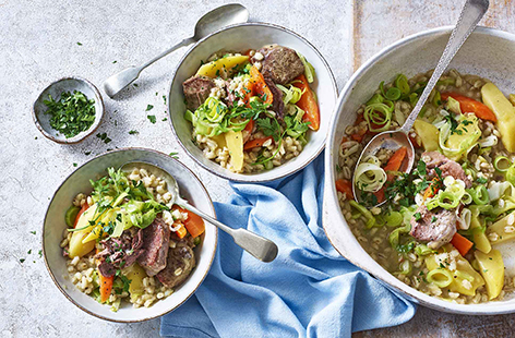 This authentic Irish stew takes care of itself, leaving you with more time to enjoy the craic with your guests. Tender lamb cutlets are seared then thrown into a pot with stock, potatoes, carrots, leeks, onions, pearl barley, then cabbage. Serve with spring onions and parsley for fresh contrast.