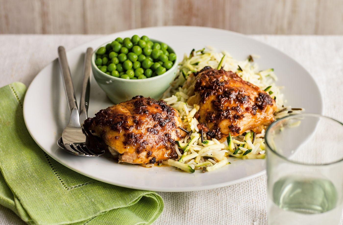 Jerk chicken with courgette wild rice and garden peas recipe