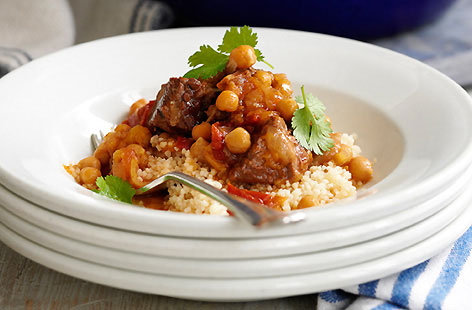 Juicy lamb, creamy chickpeas and fluffy couscous combine in this gorgeous tagine, a celebration of Middle Eastern flavours.