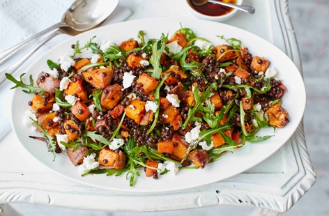 This hearty salad is packed with roasted sweet potatoes, carrots and red onion, which pair wonderfully with Puy lentils and crumbled feta