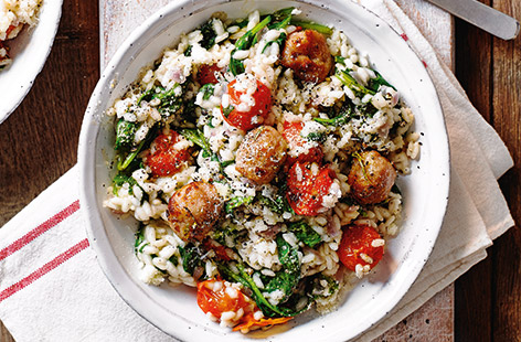 Try something new with pork sausages with this speedy tomato risotto recipe