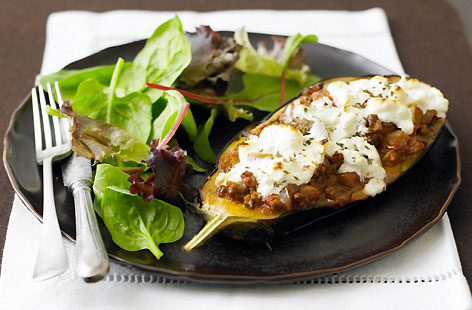 An updated version of the ever popular classic Greek dish, moussaka. Here halved aubergines, are stuffed with delicious, warmly spiced mince lamb, then baked, and topped with feta and greek yoghurt. Serve with a green salad on the side.