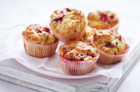 Kids will love making these gloriously pink and fruity muffins at home. Grate the butter into the dry ingredients to make it easier to combine, and remember not to scoff all the raspberries and strawberries before they go in the mixture.