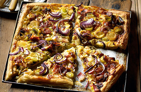 This Alsace-inspired tart is made with golden puff pastry, topped with a magical trio of softened leeks, cheese and bacon. The creamy filling is composed of whisked and seasoned crème fraîche and eggs. Ready in just half an hour, it'll have you dreaming of the mountains.