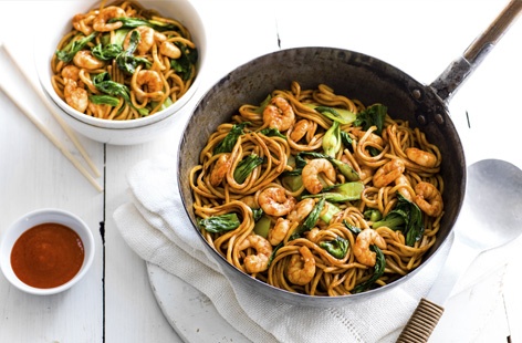 A stir-fry supper packed with flavour but made with just six ingredients. Prawns, pak choy and straight-to-wok noodles are cooked in olive oil then lifted with soy sauce and wonderfully spicy and garlicky sriracha chilli sauce. Easy and fuss-free.