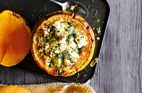 They're not just for carving! These twice-baked pumpkins, topped with fresh herbs and creamy goat's cheese, make a mouthwatering seasonal dinner
