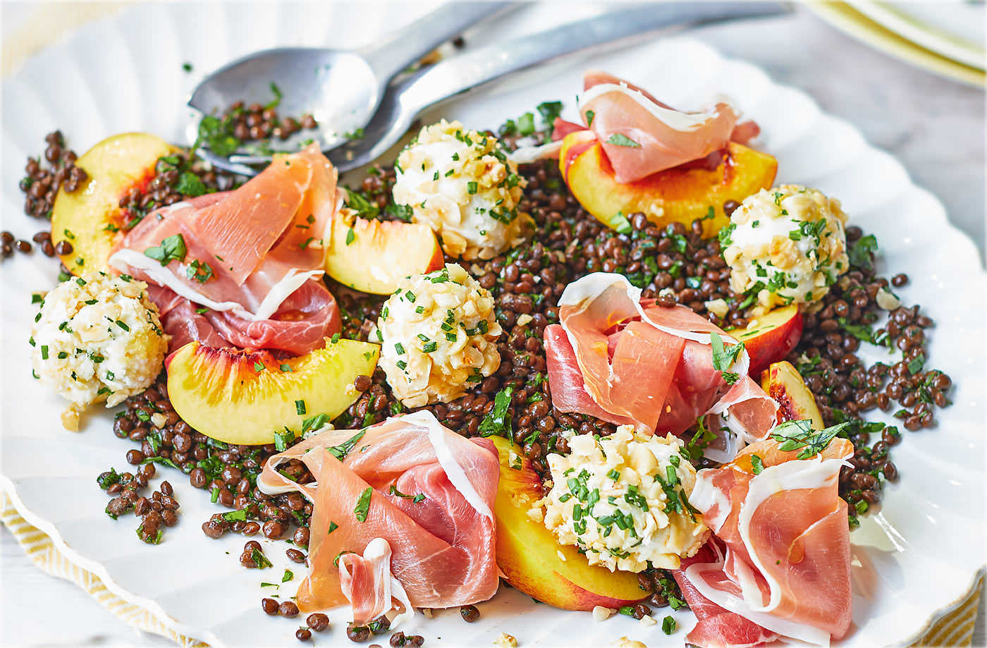 Puy lentil salad with cheese balls, Parma ham and peach recipe