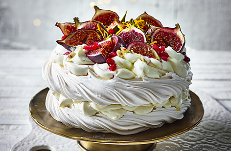 Filled with a citrus cream and topped with cardamom-scented roast figs, this is a Pavlova fit for the best dressed Christmas table.