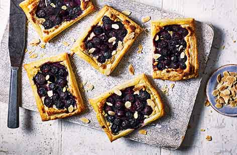 These smart individual Bakewell tarts look like they have come straight from a patisserie window, but are actually super easy to make!
