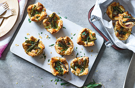 These elegant individual summer tartlets are perfect for feeding a crowd an al fresco feast. Fresh tarragon and a touch of chilli pack the creamy cheese filling with flavour, before being topped with tender flaked mackerel and griddled asparagus.